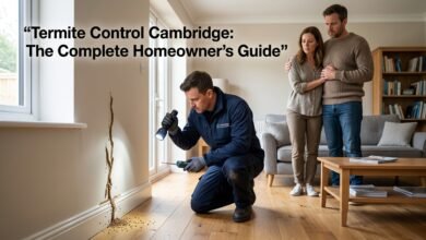 Professional termite control technician inspecting termite damage inside a modern home in Cambridge while concerned homeowners watch, highlighting expert termite control services and complete homeowner protection against termites.