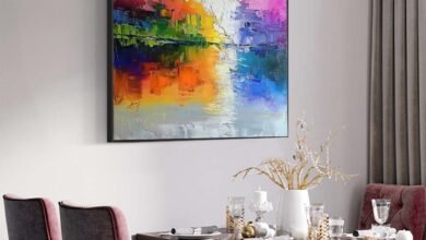 Contemporary Paintings Pakistan featuring a vibrant abstract artwork with bold colors displayed in a modern dining room interior for elegant home décor.